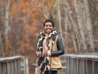 adult woman who received stem cell transplant for sickle cell disease with fall background