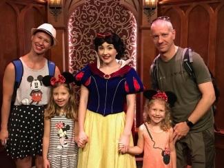 Dr. Jelena Holovati with her husband, two daughters and Snow White at Disney