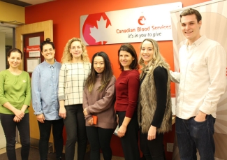 Well.ca employees at a Canadian Blood Servies office raising awareness about the need for blood donations.