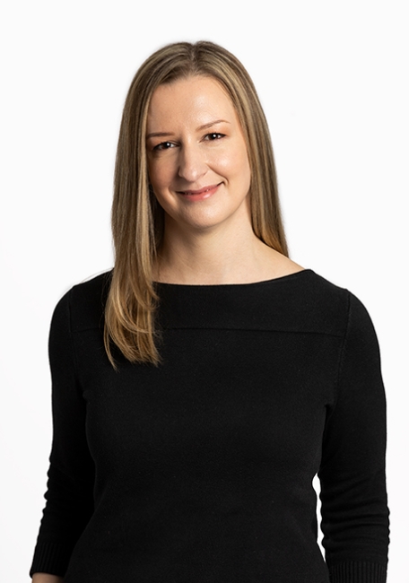 Dr Aimee Sarti on a white background wearing black shirt