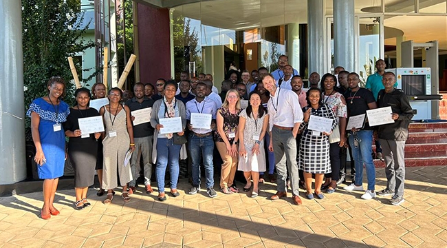 First workshop group with faculty and participants with certificates