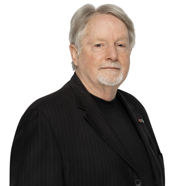 Donald Branch wearing a black blazer and a black shirt