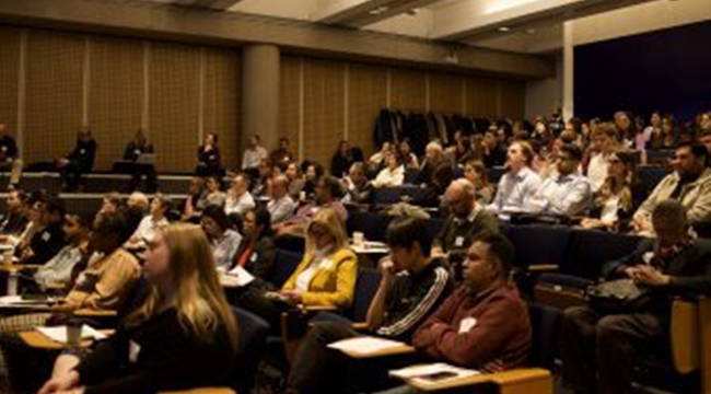 Audience members listening to speakers at the 17th Annual Earl W. Davie Symposium