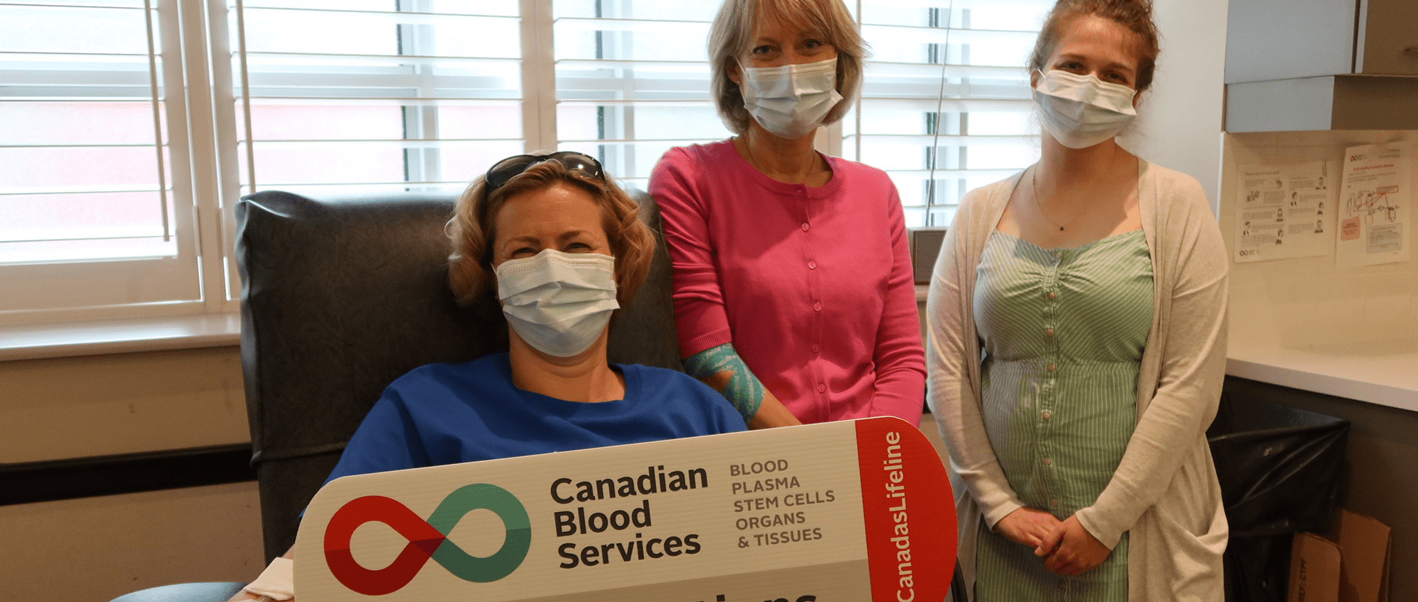 RBC Blood donor in donor chair with Canadian Blood Services staff   