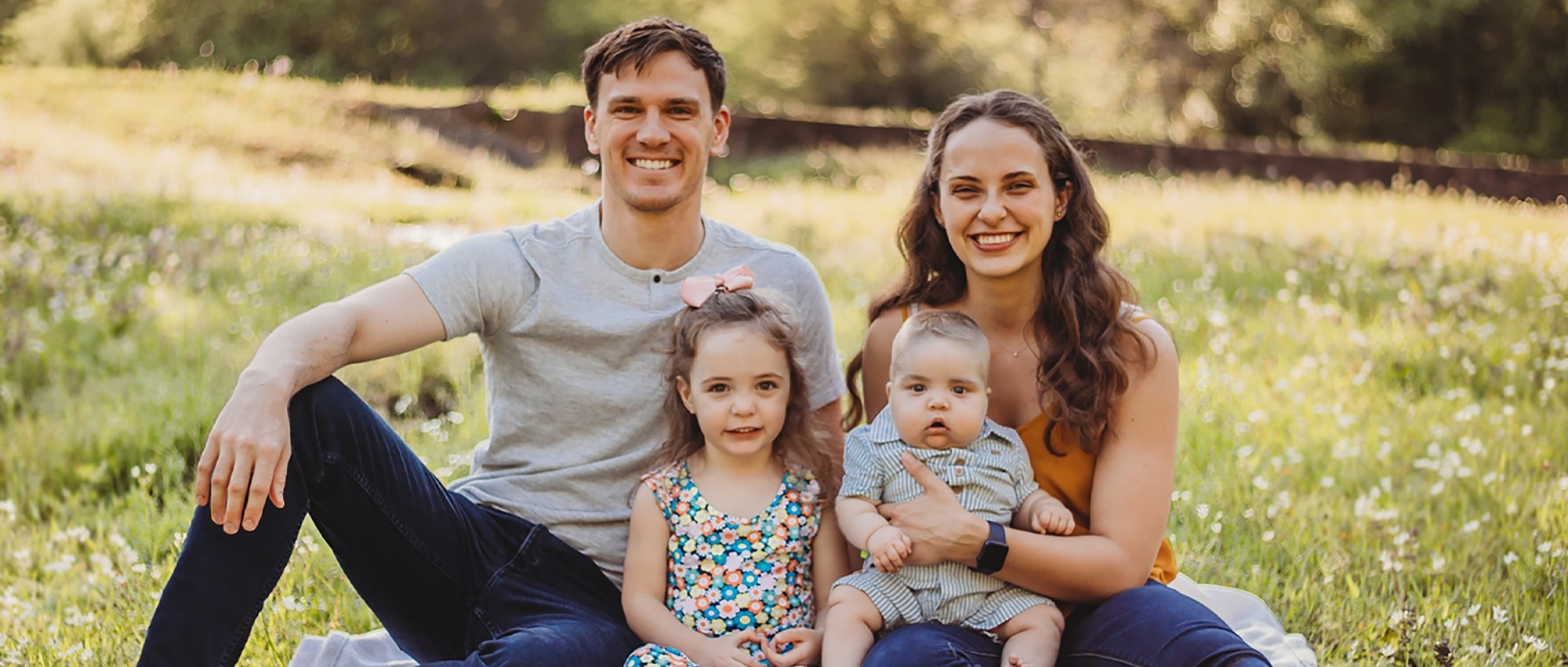 Stem cell recipient’s family sitting on the grass