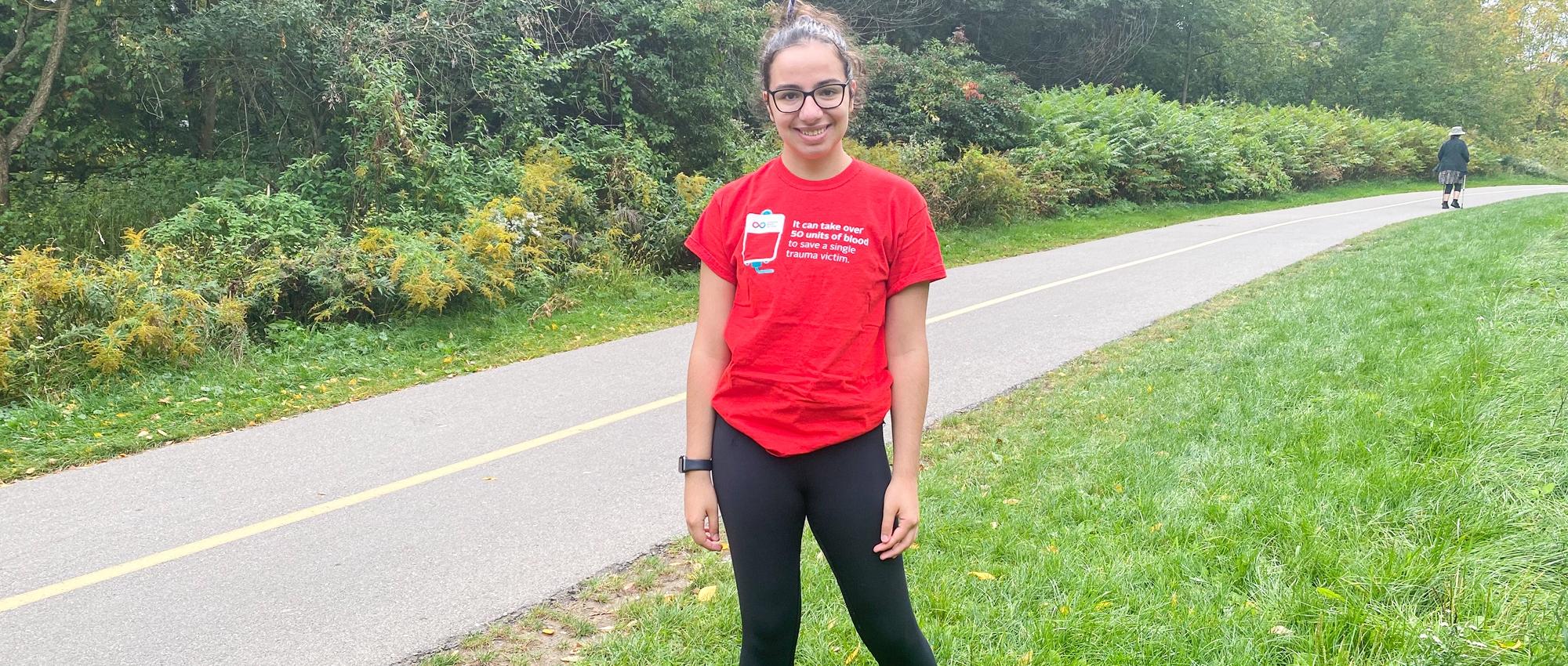 Natalie Pallisco plasma recipient and blood donor posing while out for a run