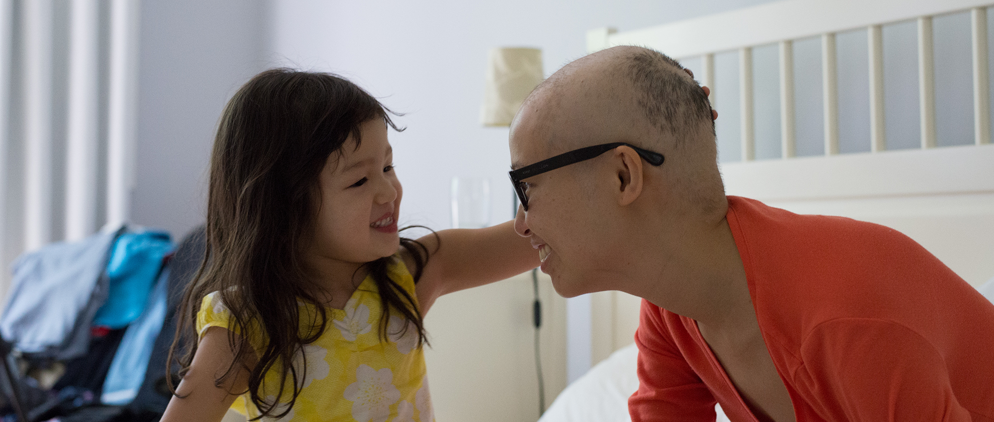 Stem cell recipient and advocate Mai Duong smiles with her daughter  