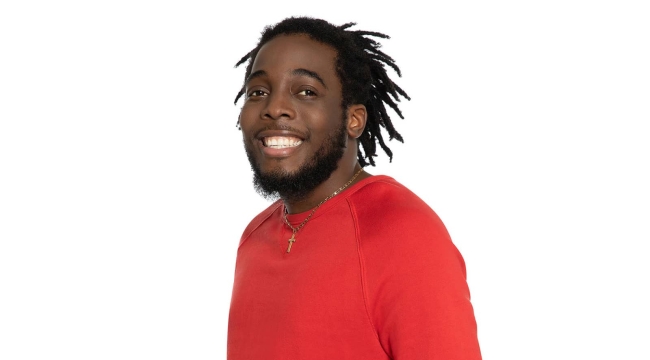 Blood recipient wearing red shirt and cross necklace