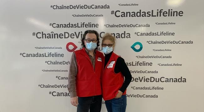 Paul and Geri Laforet standing in front of a Canadian Blood Servies mural during National Volunteer Week