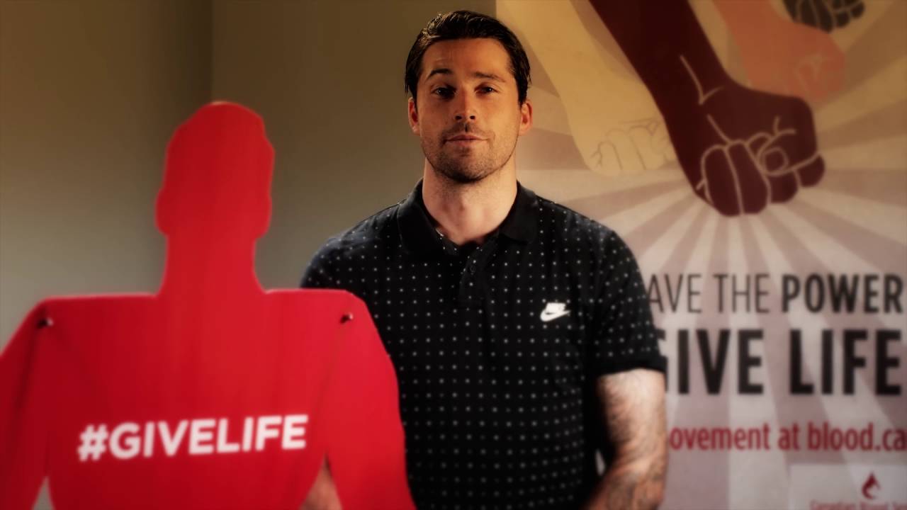 YouTube video thumbnail of Erik Gudbranson next to a #givelife standee