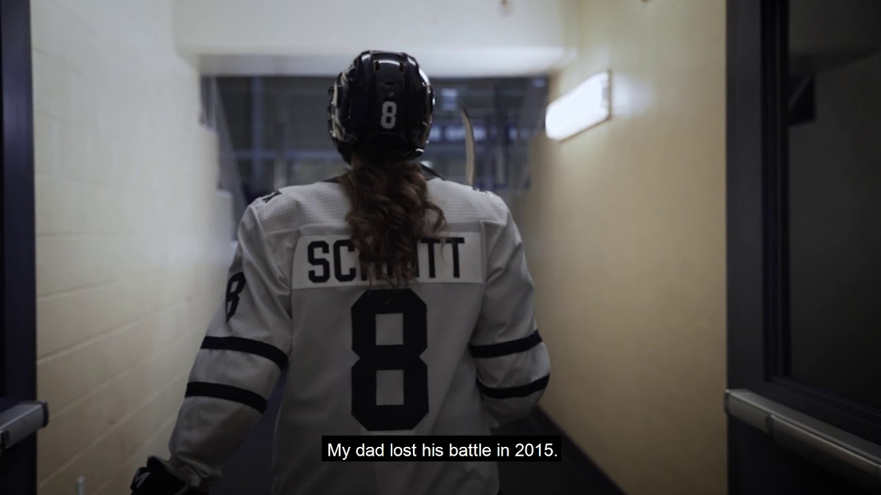 YouTube video thumbnail of Julia Schmitt in full hockey gear, with caption &quot;My dad lost his battle in 2015&quot;